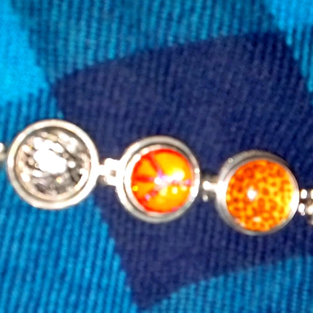 A Premier Bracelet with 7 different buttons